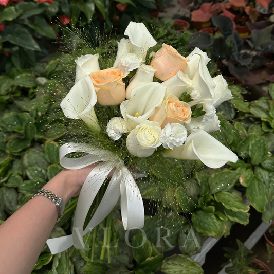 Bridal Bouquet of Calla Lilies, Champagne Roses, White Roses and White Carnation Sprays, paired with airy green fillers.
